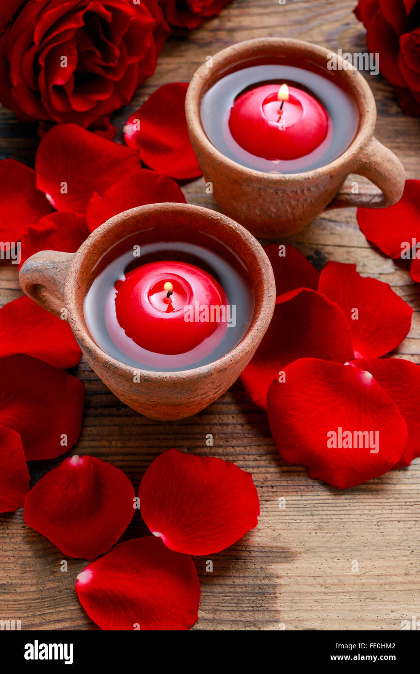 Floating candles in water among rose petals. Aromatherapy in spa Stock ...