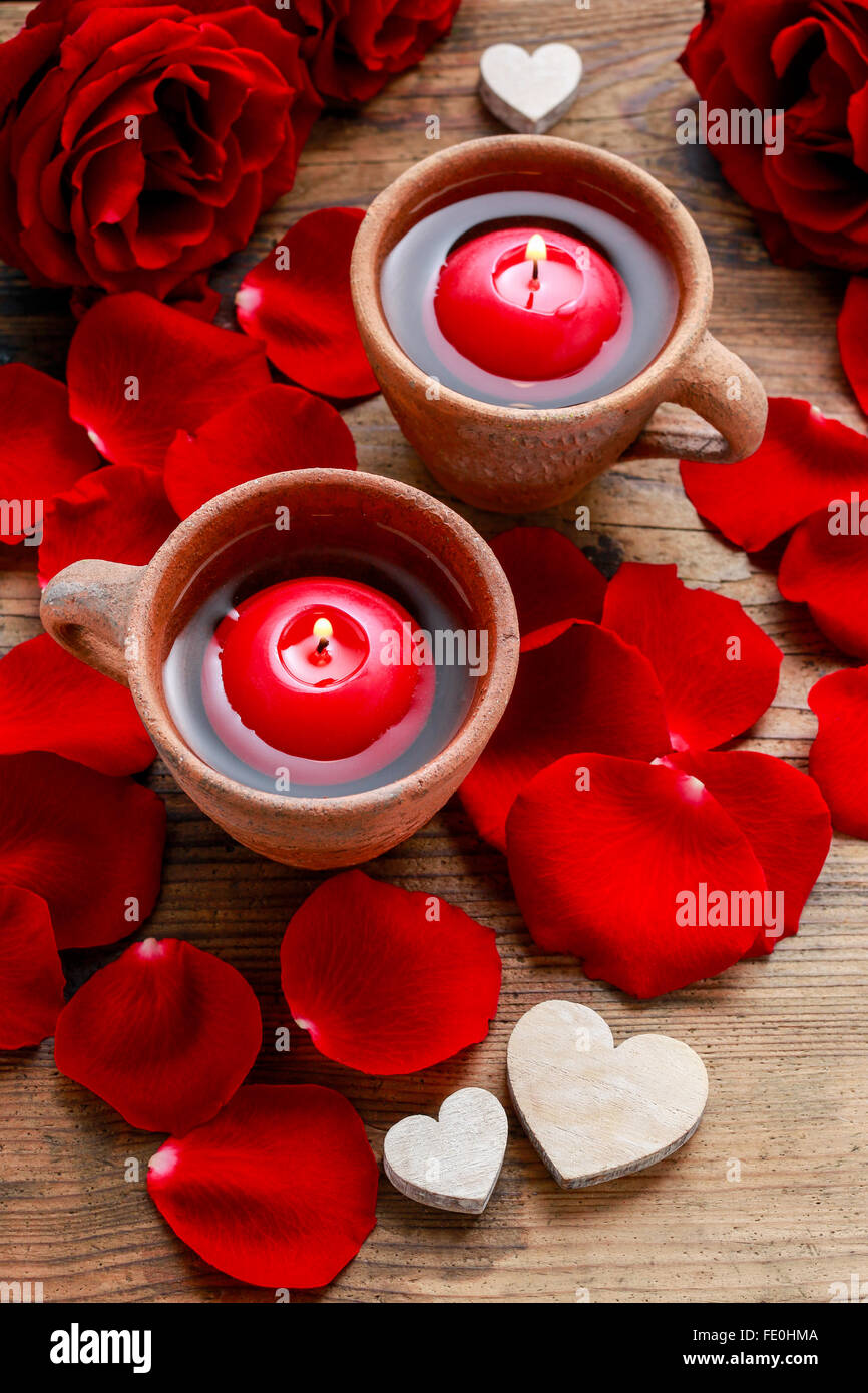 Floating candles in water among rose petals. Aromatherapy in spa Stock ...