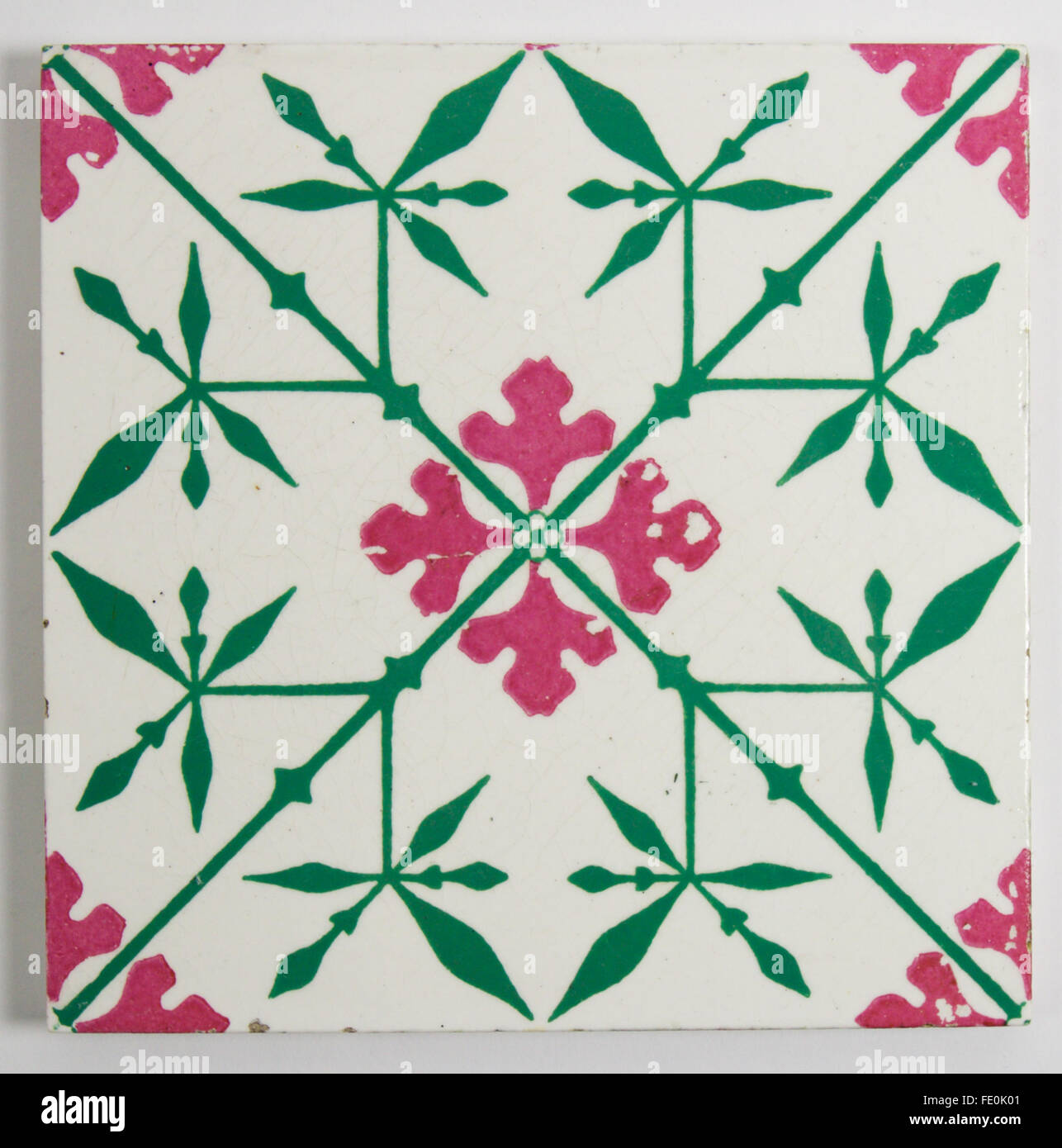 Antique Minton Gothic Revival tile designed by A.W.N. Pugin circa 1860. The printed and enamelled tile is in a striking green an Stock Photo