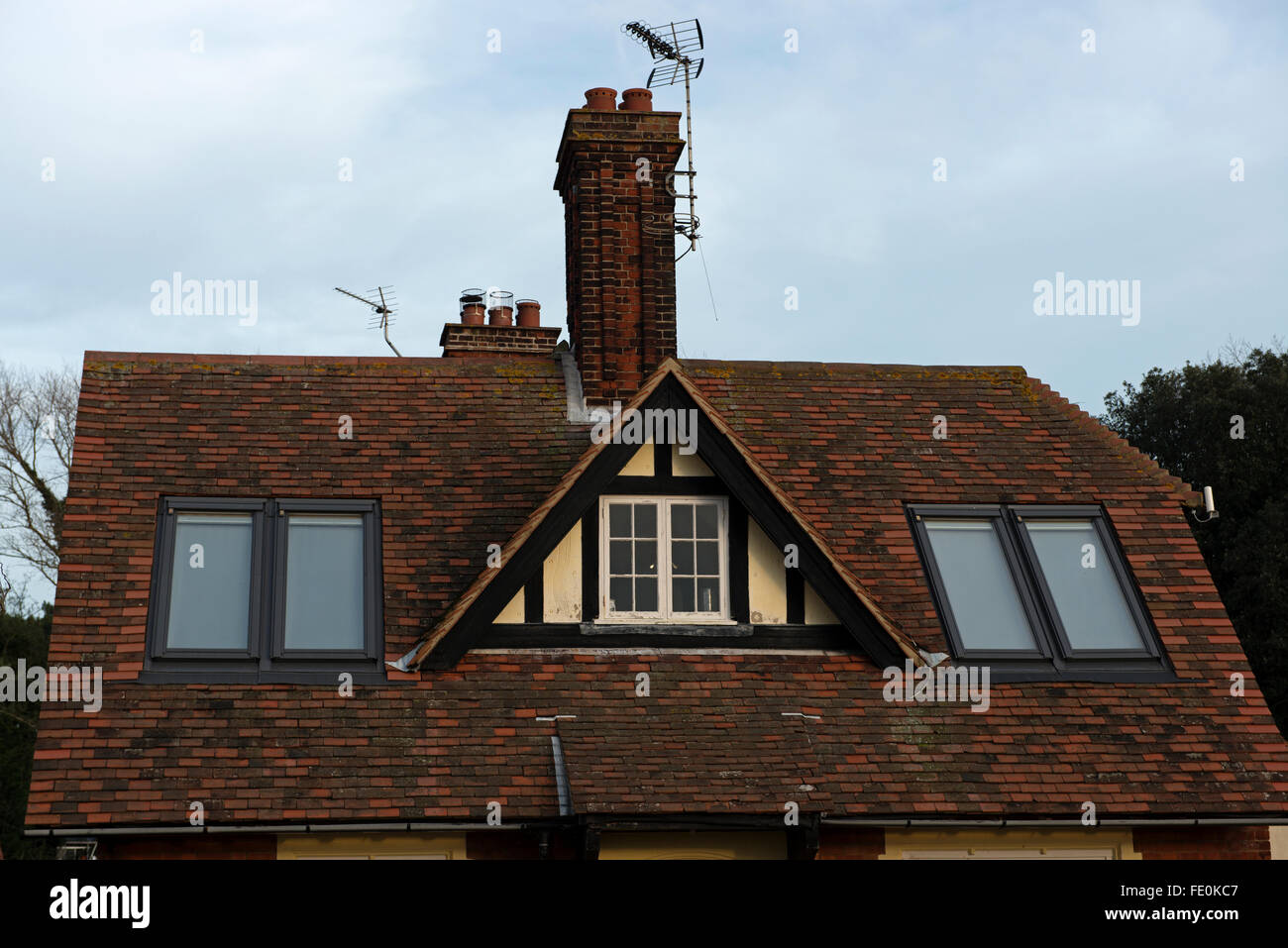 House with windows fitted into roof Stock Photo Alamy