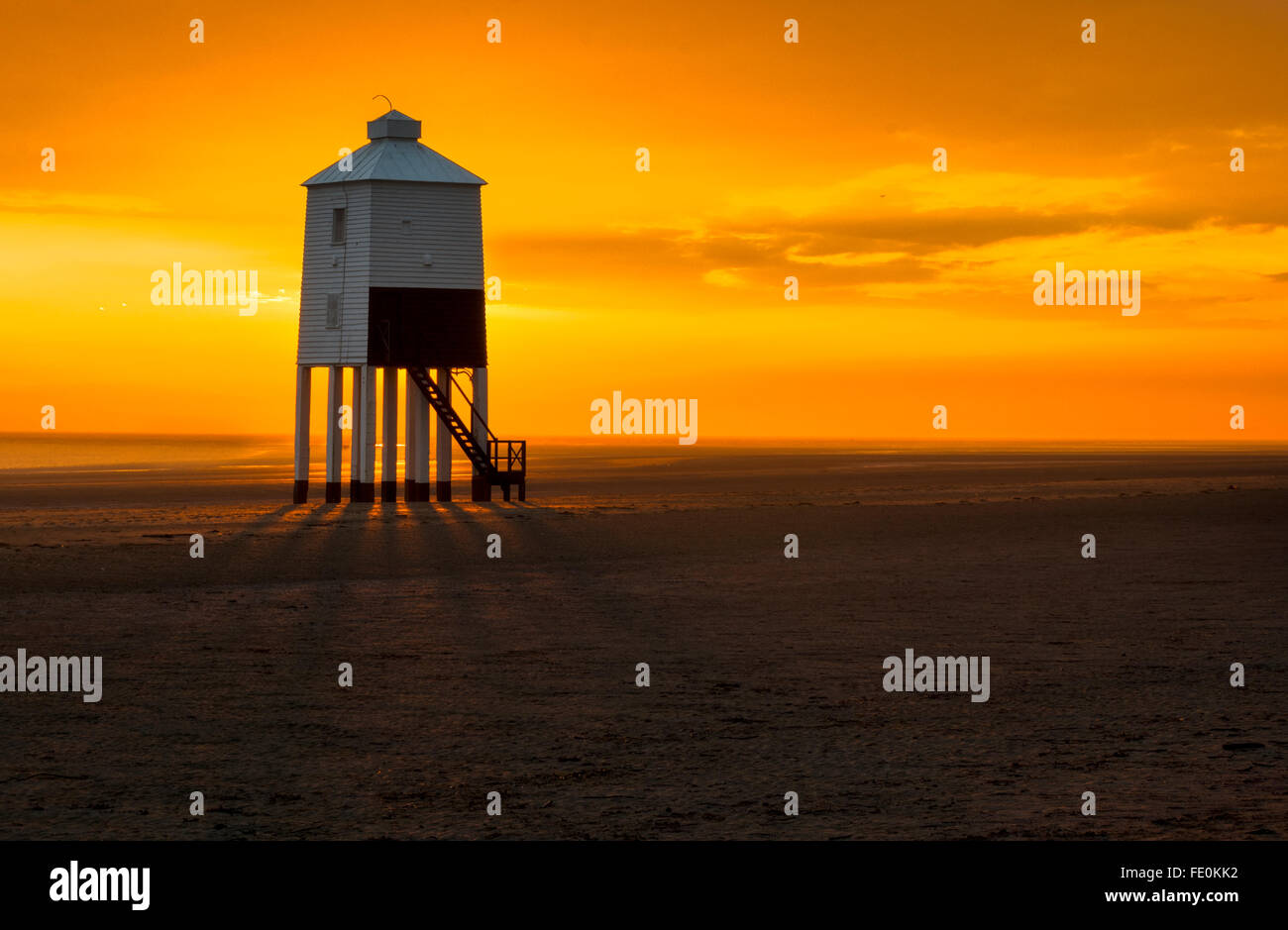 An amazing  stunning sunset over Burnham on sea Lighthouse which is wooden and on stilts Stock Photo