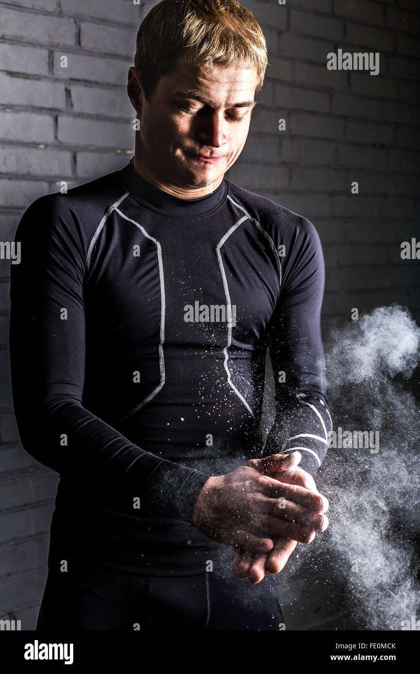 Portrait athletic man with chalk powder in hands Stock Photo Alamy