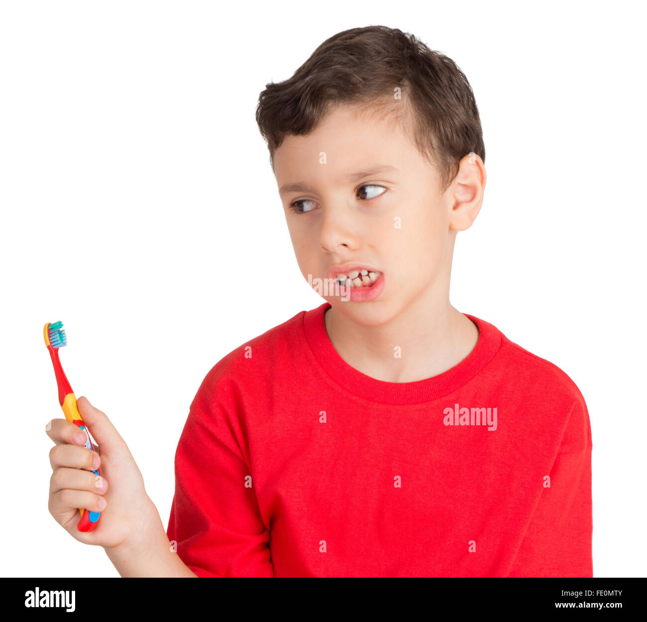 Young boy looking in angry way to his teeth brush Stock Photo