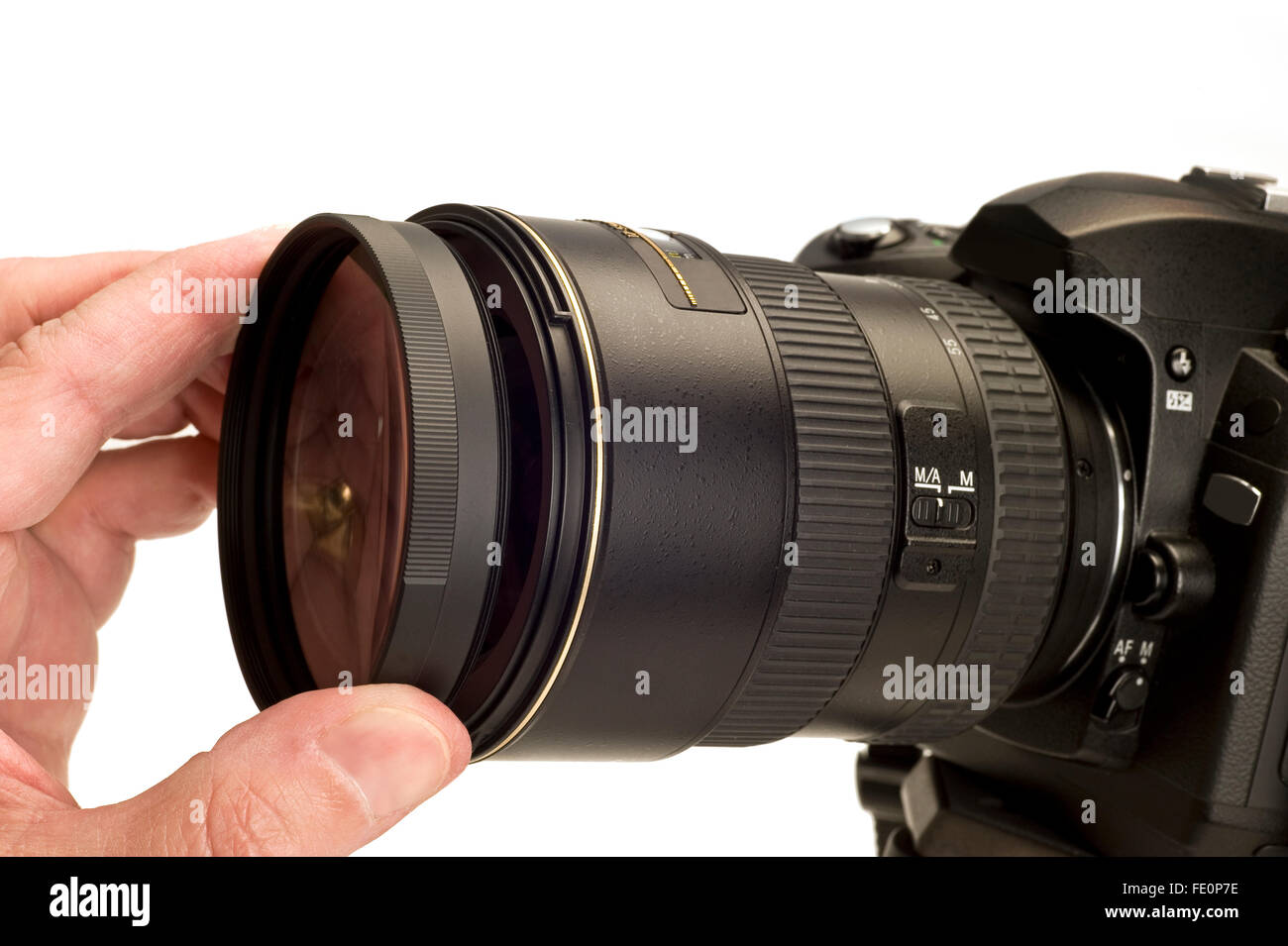 Putting Filter On Camera Lens Stock Photo Alamy
