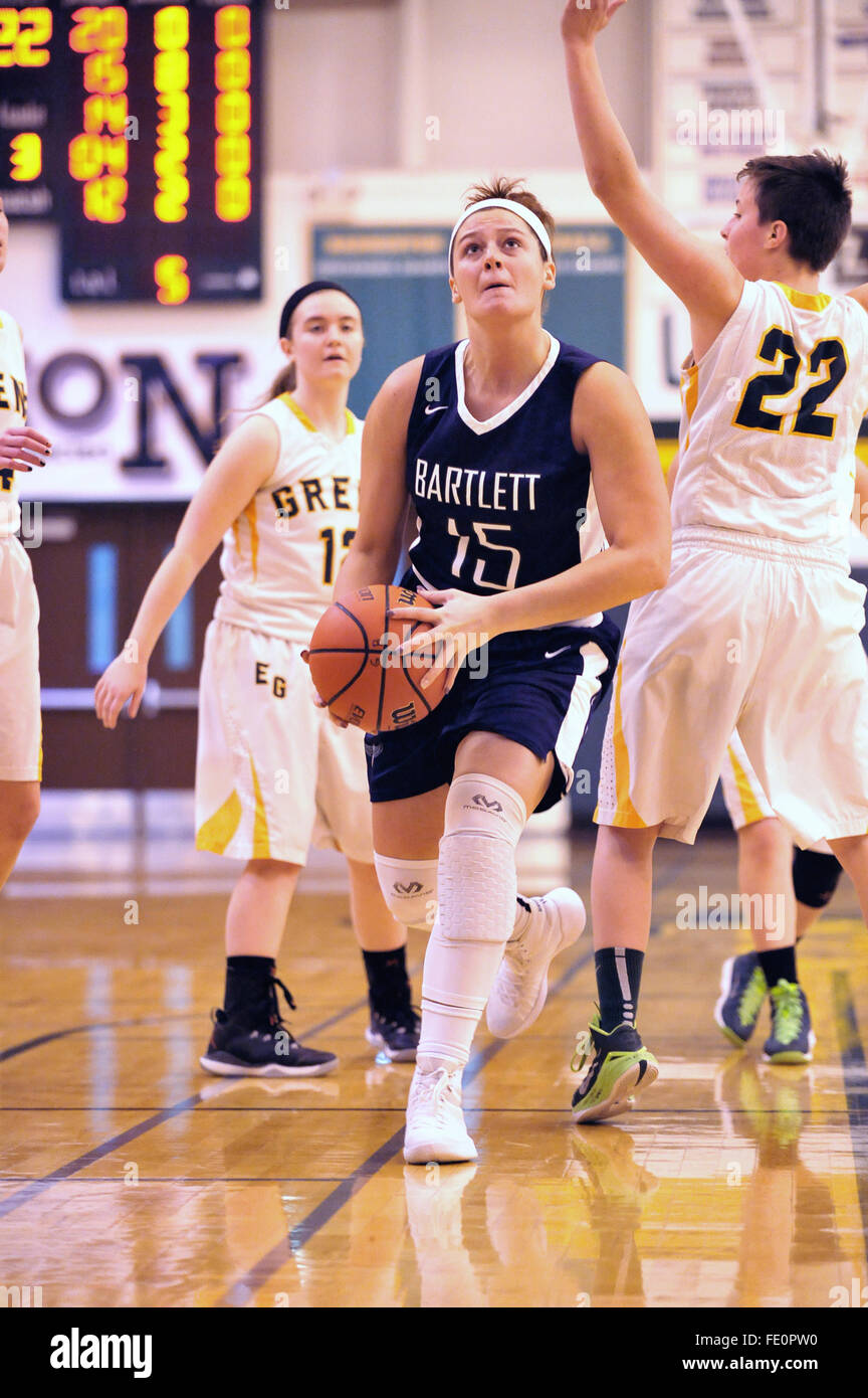 Player driving through the paint prior to putting up a shot during a high school basketball game. USA. Stock Photo