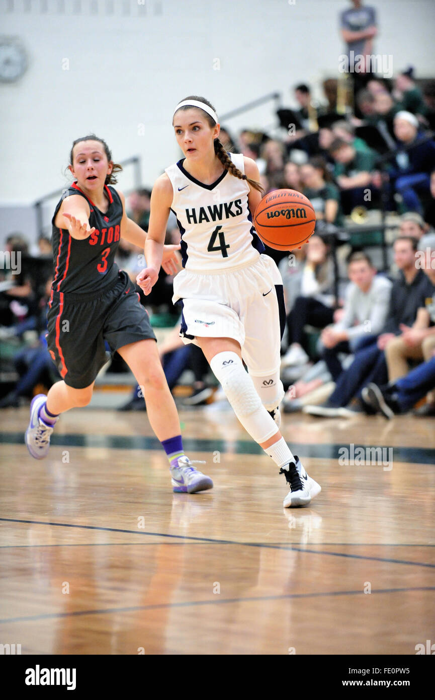 A high school player driving on the basket after negotiating past a  defender as she approaches the baseline. USA Stock Photo - Alamy