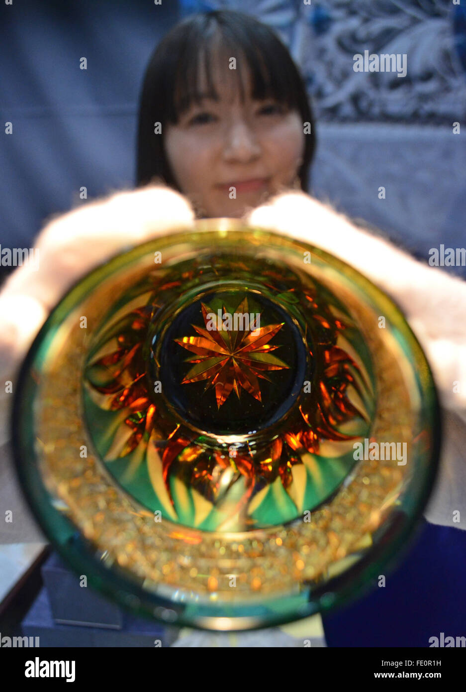 Tokyo, Japan. 3rd Feb, 2016. Yuri Kataoka of Kowasho Co. holds a 30000 yen crafted glass during the 81st Tokyo International Gift Show Spring 2016. The show offers a collection of the latest smart phone goods, stationary, hobby material goods, exhibits of personal gifts, consumer goods and decorative accessories. The show also includes a new product contest in which more than 400 new products enter to compite. Also a collection of unique products from all over the world to compete in the most popular imported product contest. Kitchen and dining room goods contest. Established in 1976, TIGS is Stock Photo