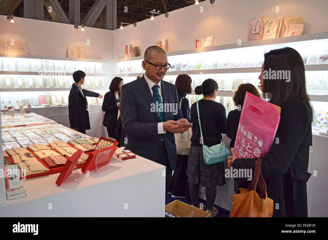 Tokyo, Japan. 3rd Feb, 2016. Hidenori Tanaka of Washiclub Co. Japan talks to an atendee during the 81st Tokyo International Gift Show Spring 2016. The show offers a collection of the latest smart phone goods, stationary, hobby material goods, exhibits of personal gifts, consumer goods and decorative accessories. The show also includes a new product contest in which more than 400 new products enter to compite. Also a collection of unique products from all over the world to compete in the most popular imported product contest. Kitchen and dining room goods contest. Established in 1976, TIGS is Stock Photo