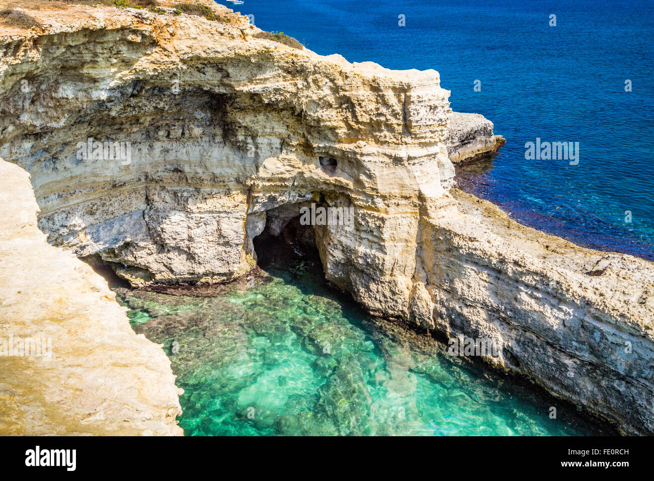 Rocky stacks of Saint Andrew Tower on the coast of Salento in Apulia in Southern Italy Stock Photo