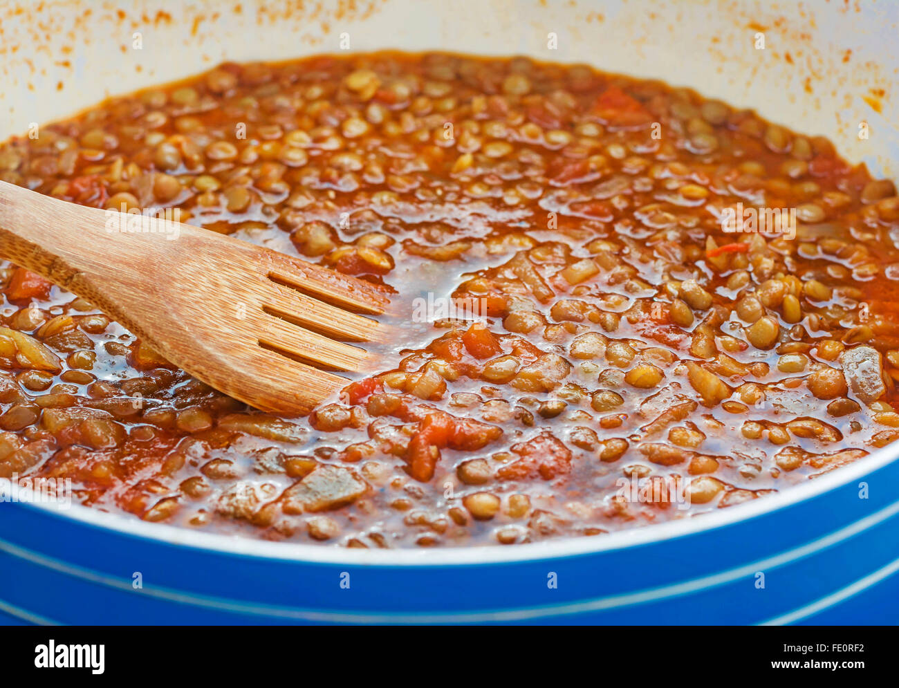 Cooking lentils stew. Vegetarian meal Stock Photo Alamy