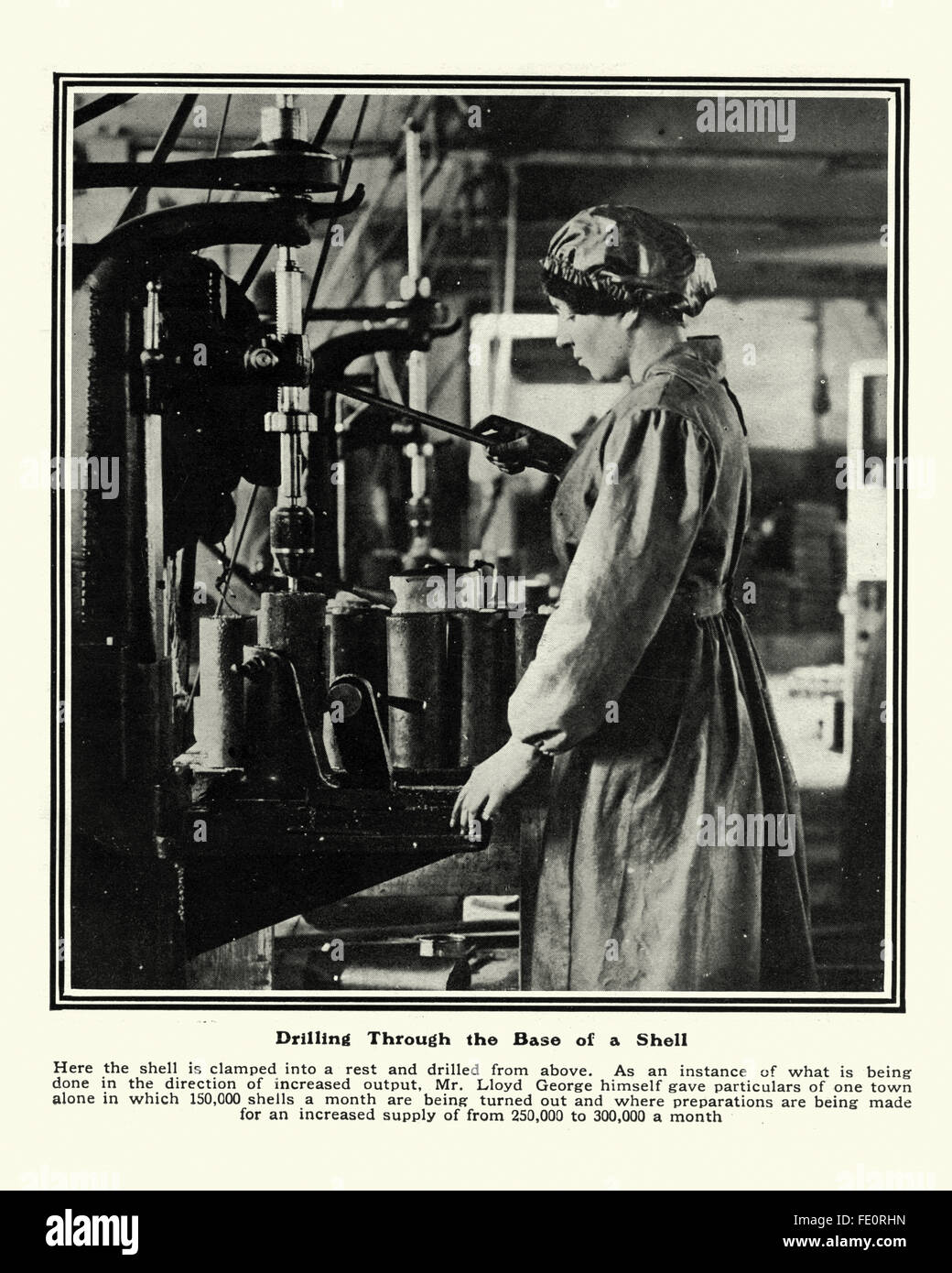 Woman working in a first world war munitions factory drilling through the base of a artillery shell Stock Photo