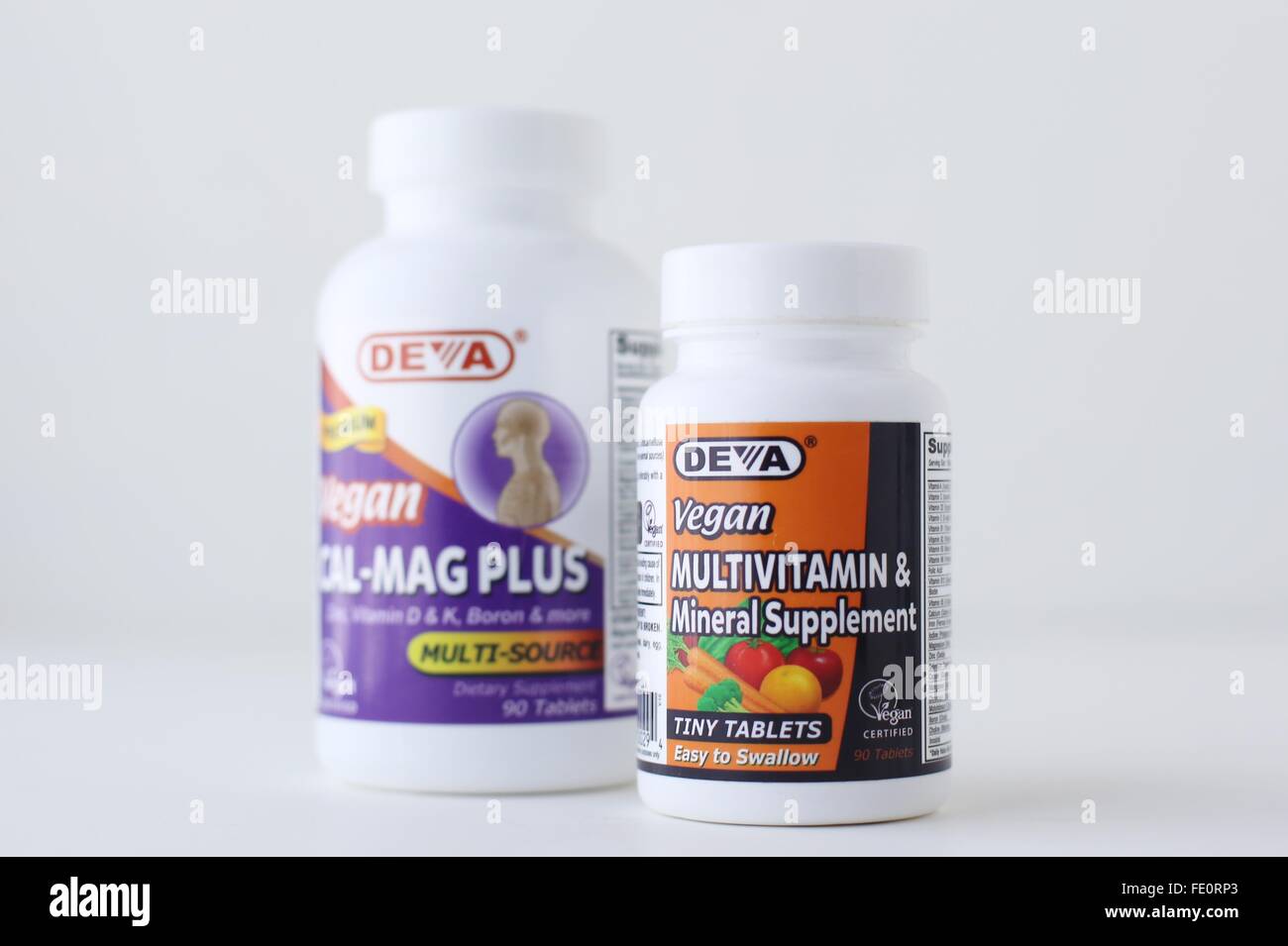 Bottles of vegan multivitamins and calcium magnesium supplements Stock