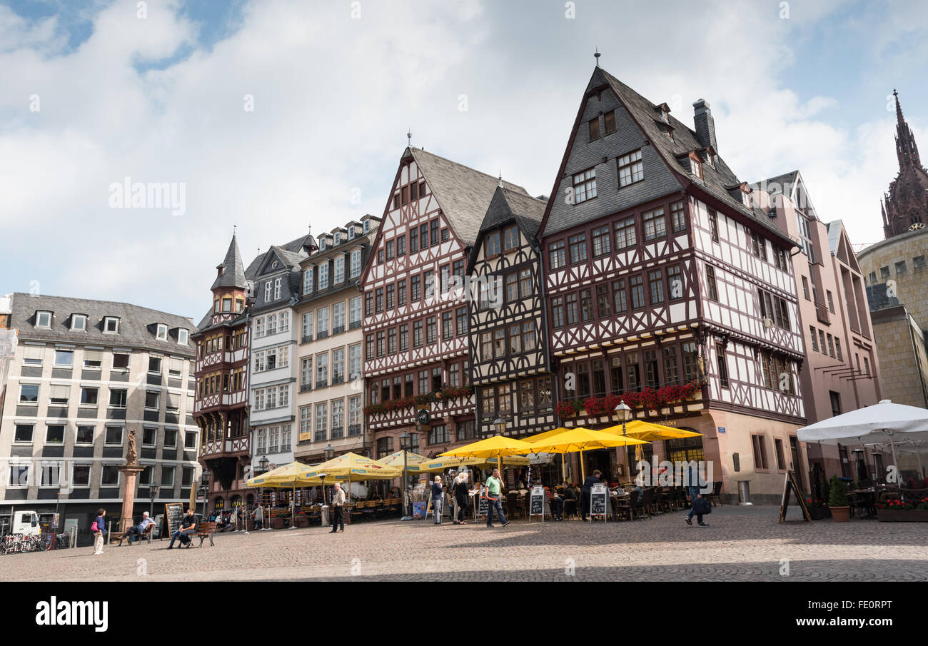Tourists enjoying the famous historical landmark of Römerberg square at ...