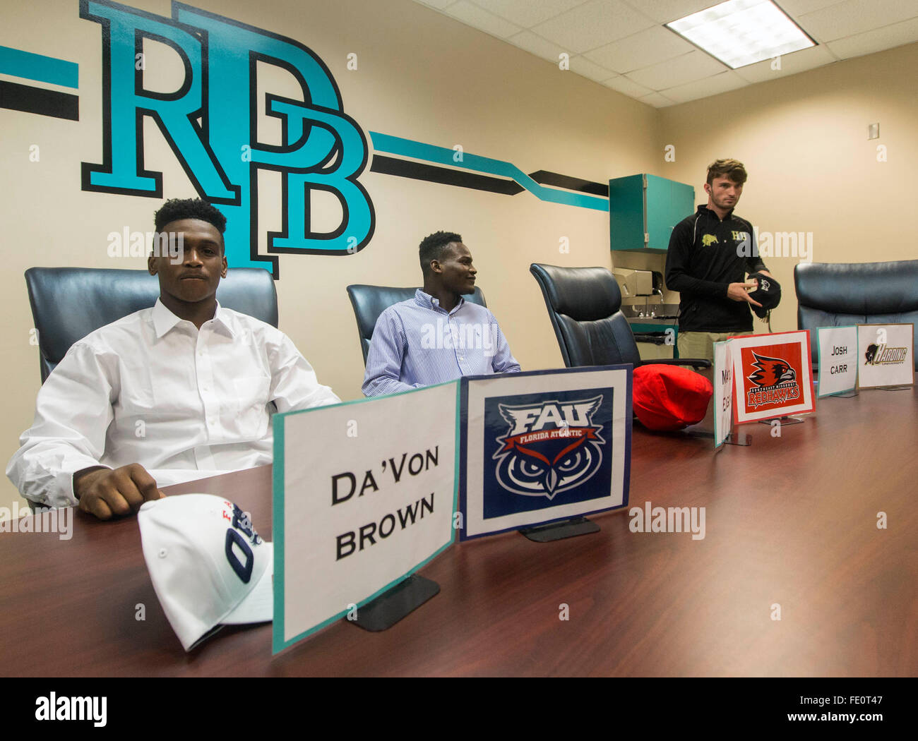 Royal Palm Beach, Florida, USA. 3rd Feb, 2016. Da'Von Brown (L), Marlon Eugene,(C), and Josh Carr, (R), before the start of Signing Day at Royal Palm Beach High School February 03, 2016 in Royal Palm Beach. Brown a defensive back signed with Florida Atlantic University, Eugene, a linebacker signed with Southeast Missouri State University, and Carr, a quarterback signed with Harding University. © Bill Ingram/The Palm Beach Post/ZUMA Wire/Alamy Live News Stock Photo