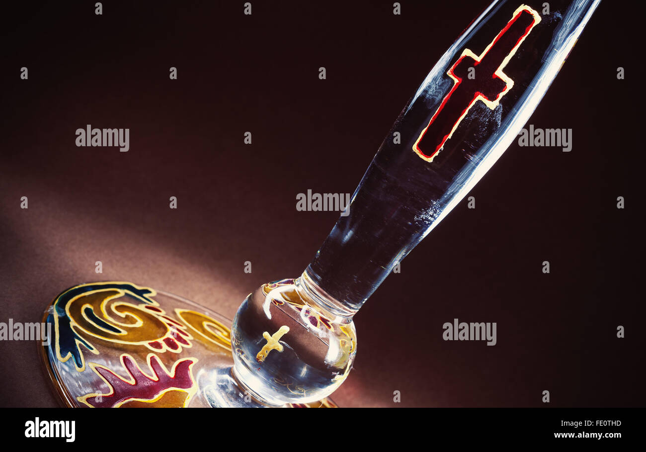 Candle on stand decorated with Christian symbols Stock Photo Alamy