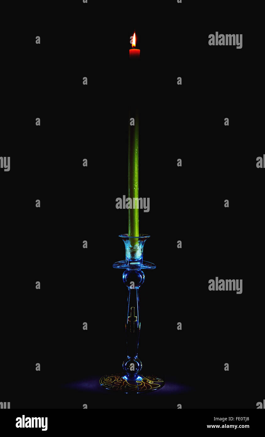 Candle on stand decorated with Christian symbols Stock Photo Alamy