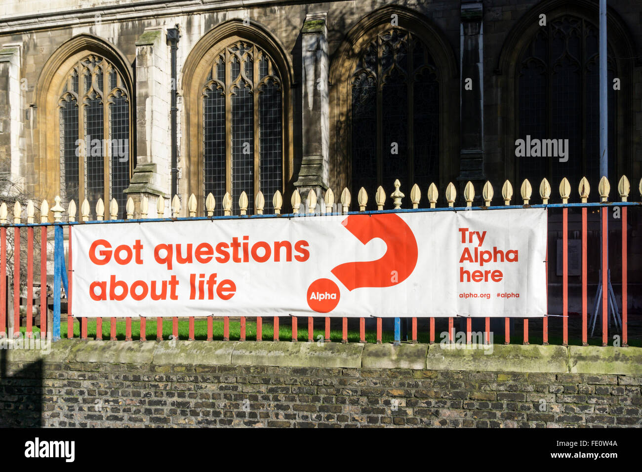 A banner advertising the alpha course outside St. Sepulchre-Without-Newgate church in Holborn, London. Stock Photo