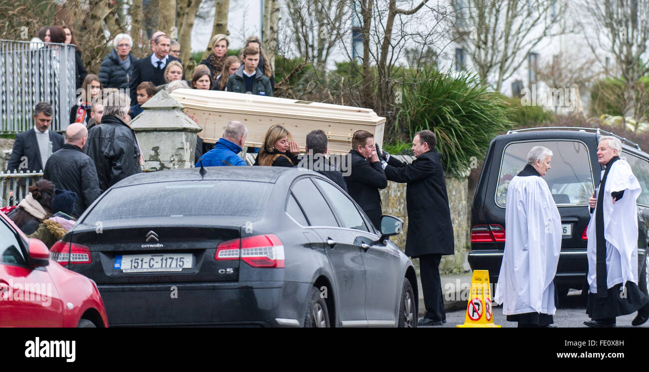 Schull, Ireland. 3rd February, 2016. Colin Vearncombe, aka 'Black' is shouldered from Holy Trinity Church, Schull.  His second wife, Camilla Griehsel, can be seen bearing the coffin. He was carried to St. Mary's Church before leaving to await cremation on 4th February, 2016. Credit: Andy Gibson/Alamy Live News. Stock Photo