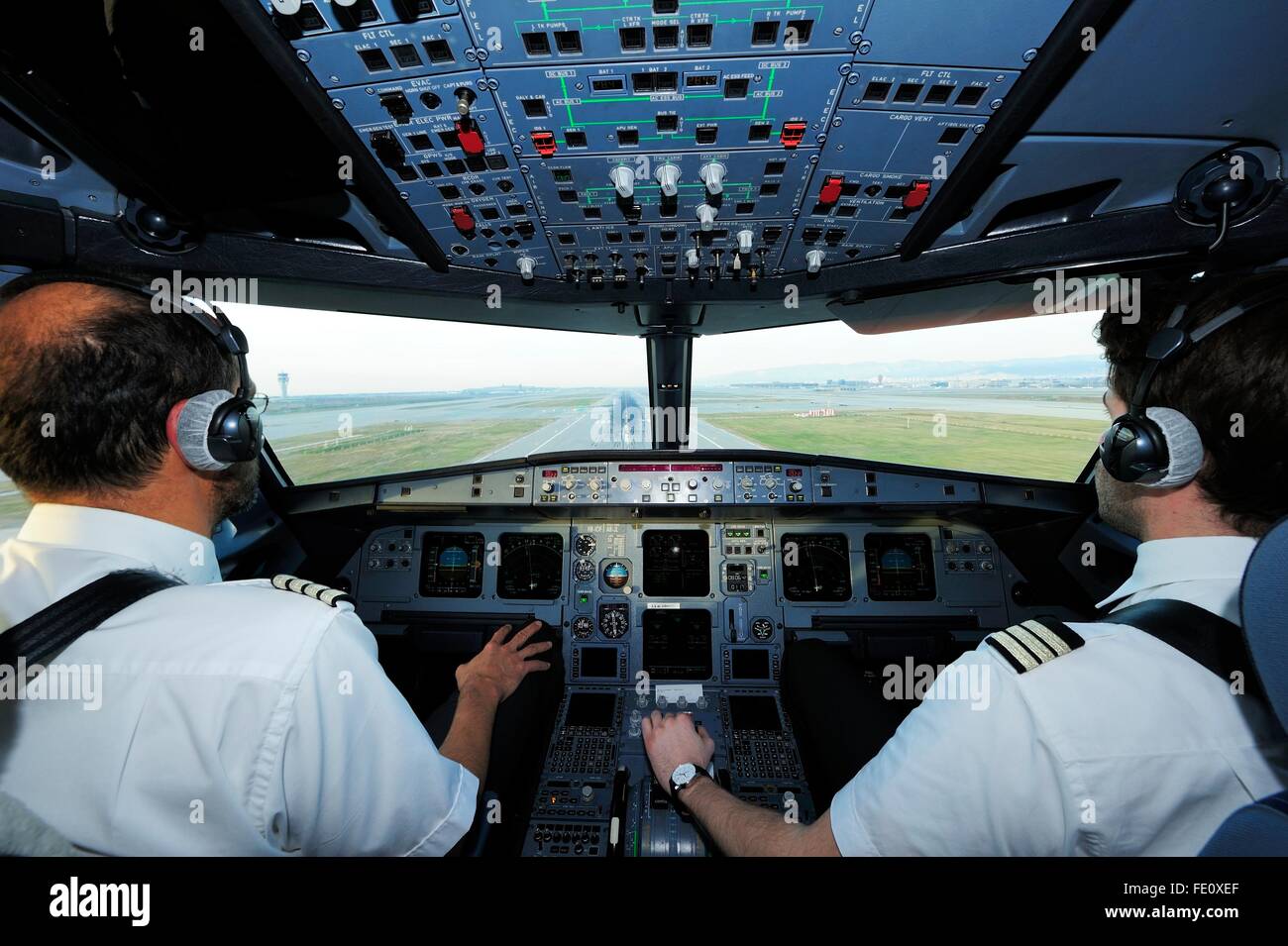 Pilot and copilot in cockpit, Airbus A321 Stock Photo