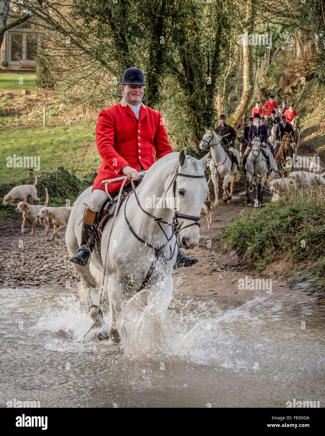 North Cotswold Hunt on Christmas Eve crossing a ford Stock Photo