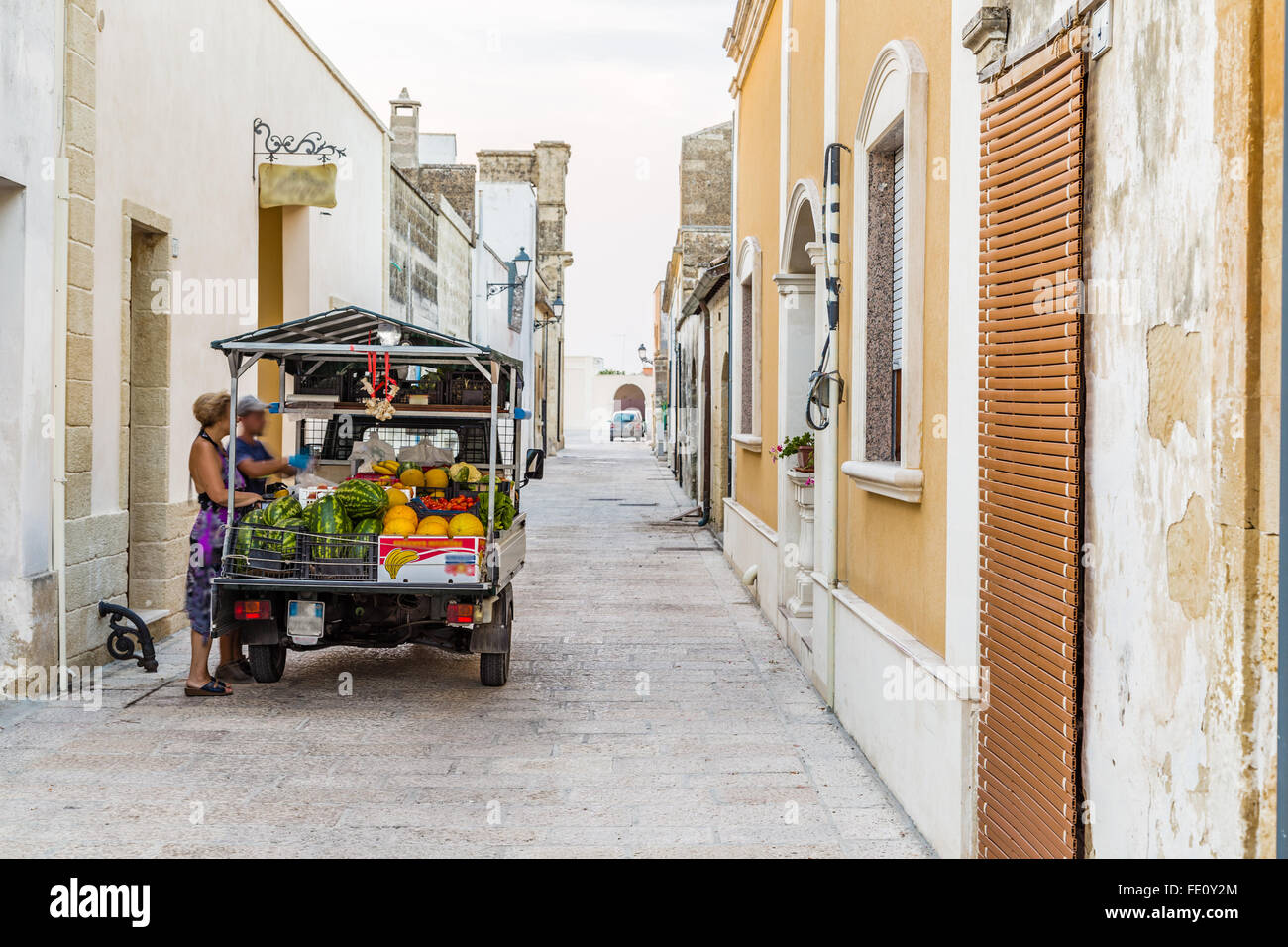 three-wheeled light commercial vehicle in the grid of streets and walls of fortified citadel of XVI century in Italy Stock Photo