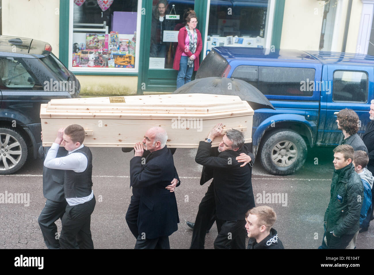 Schull, Ireland. 3rd February, 2016.  Colin Vearncombe's coffin is carried along Main Street, Schull to St Mary's Church, before leaving for cremation on 4th February, 2016. Credit: Andy Gibson/Alamy Live News. Stock Photo