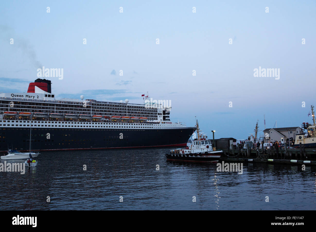 The Queen Mary 2 cruise ship sails out of Halifax, Canada Stock Photo