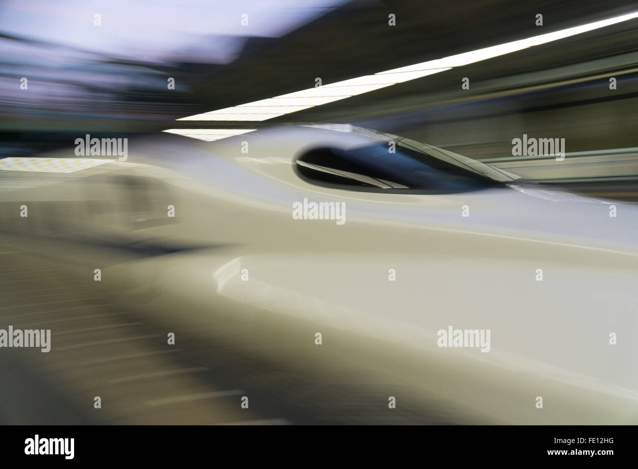 Shinkansen bullet train blurring in Japan Stock Photo