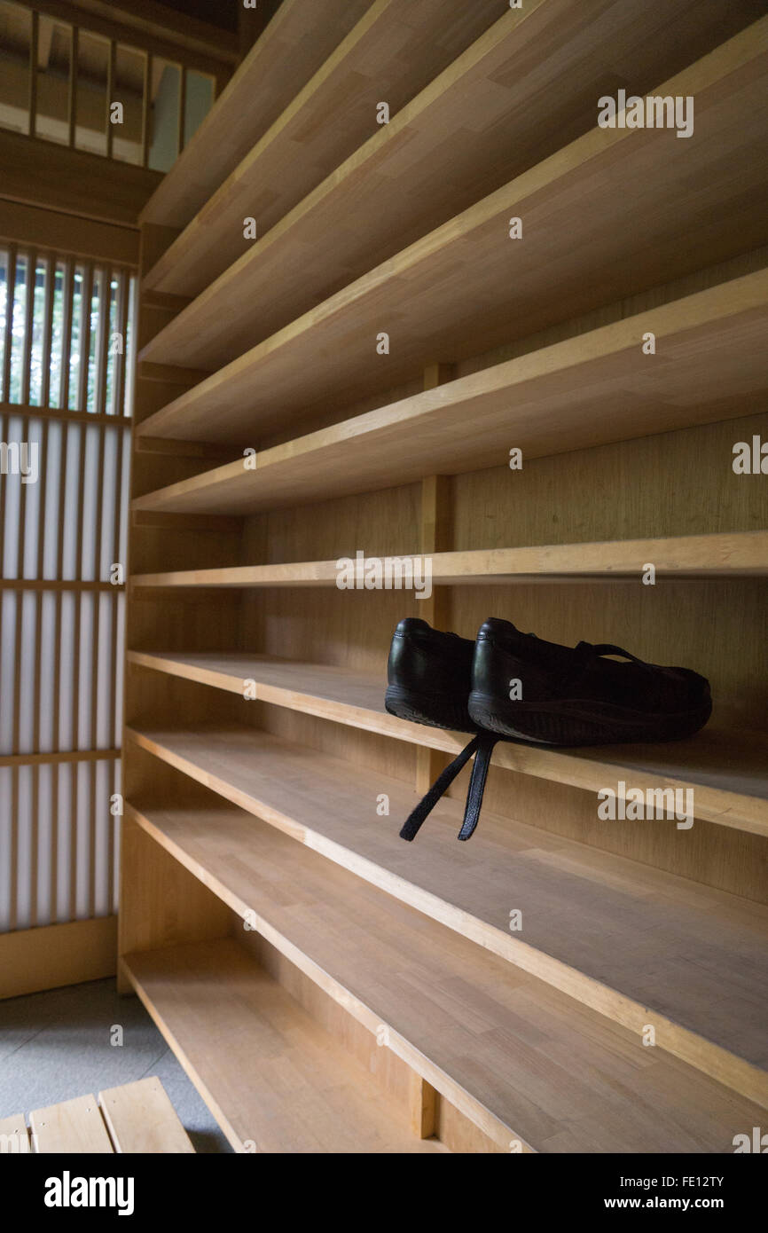 shoes in rack at a shrine in Kyoto Japan Stock Photo