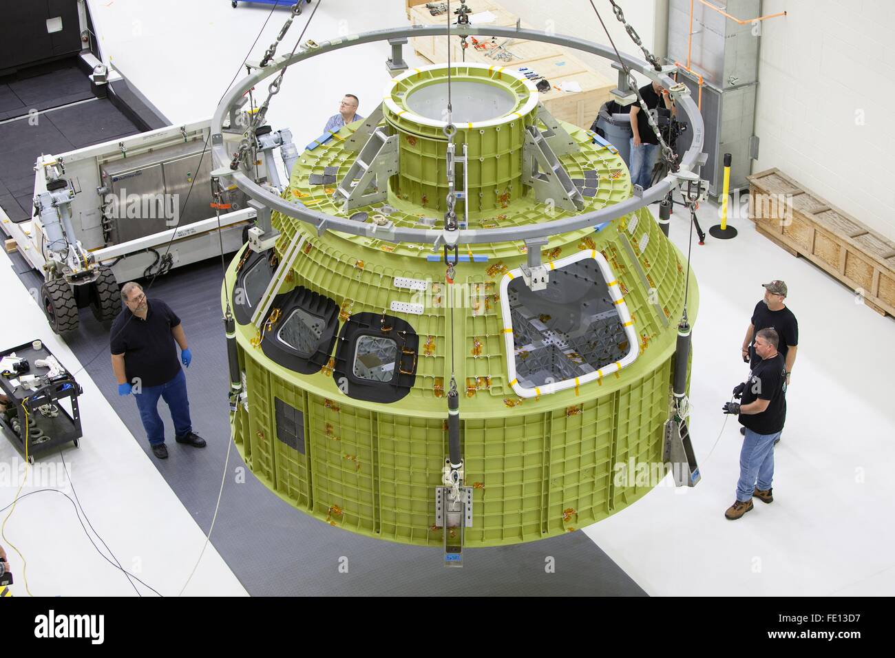 Cape Canaveral, Florida, USA. 02nd Feb, 2016. The Orion Multi-Purpose Crew module pressure vessel capsule project EM-1 is lifted by crane inside the Neil Armstrong Operations and Checkout Building at the Kennedy Space Center February 2, 2016 in Cape Canaveral, Florida. The Orion spacecraft will launch atop NASA Space Launch System rocket on EM-1, an un-crewed test flight in 2018. Stock Photo