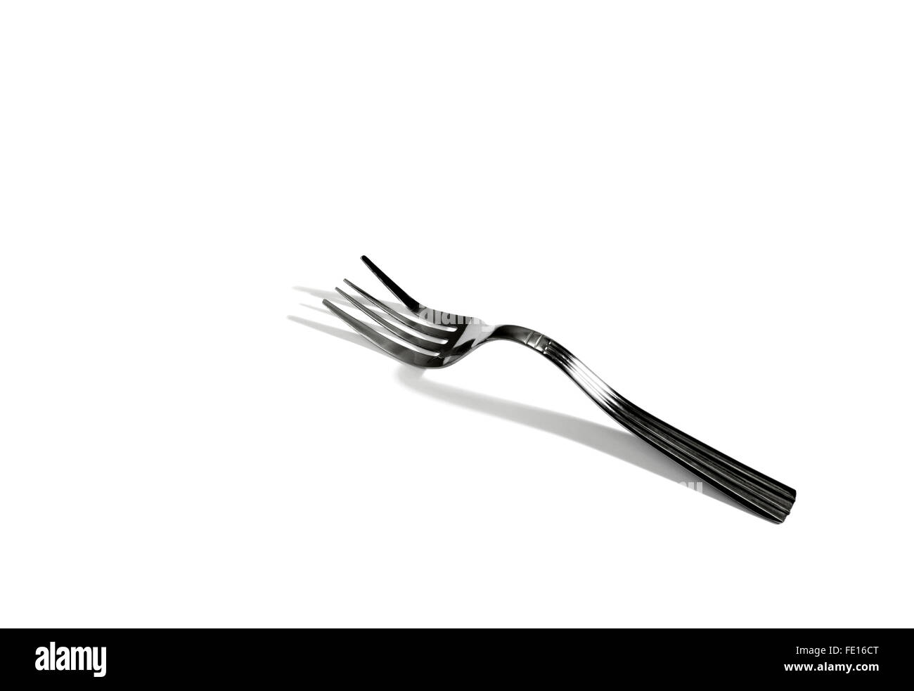 Studio Shot of a Silver Bent fork on a White Background Stock Photo
