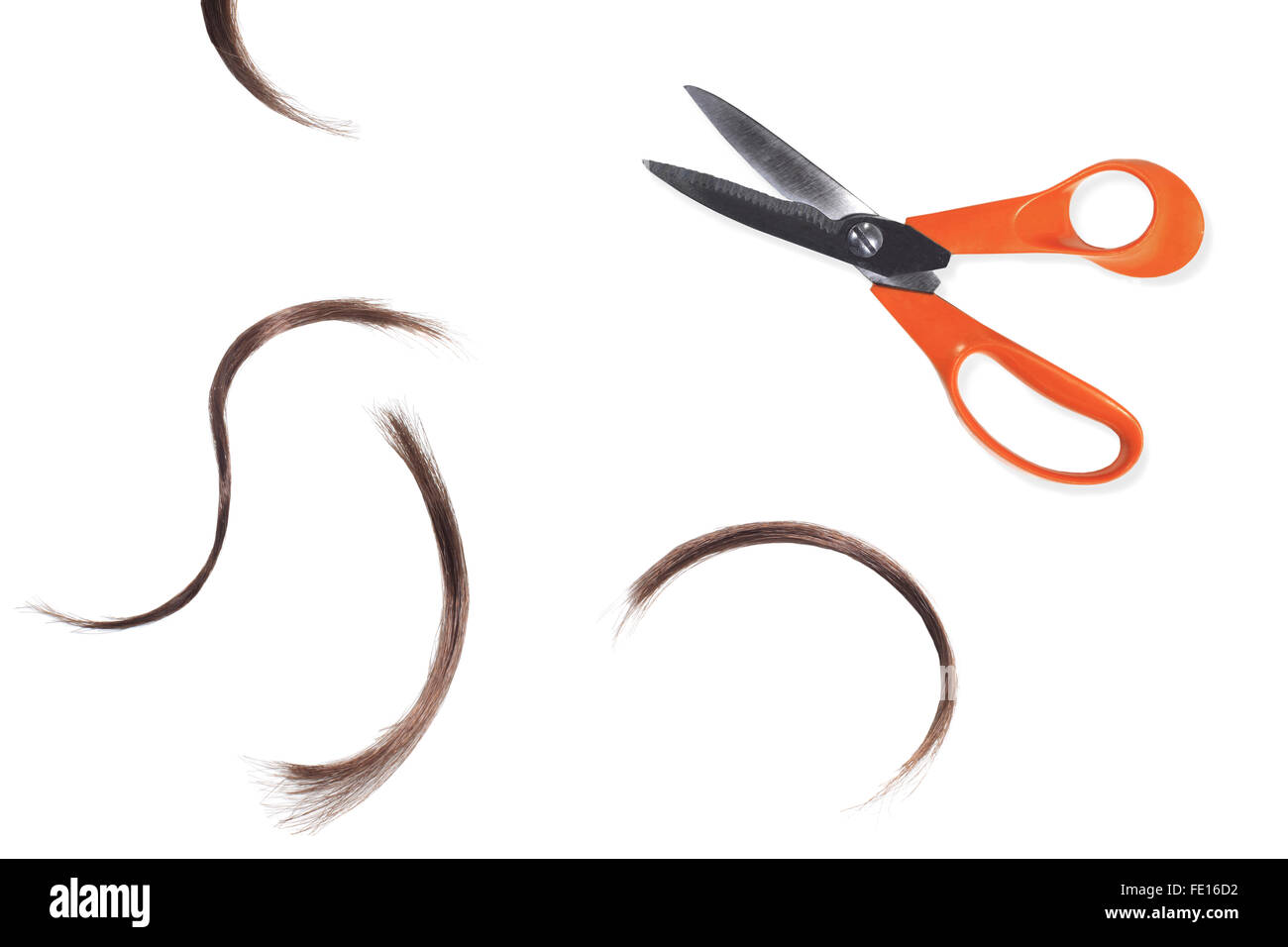 Studio Shot of a Pair of Scissors and Hair Clippings on a White Background Stock Photo