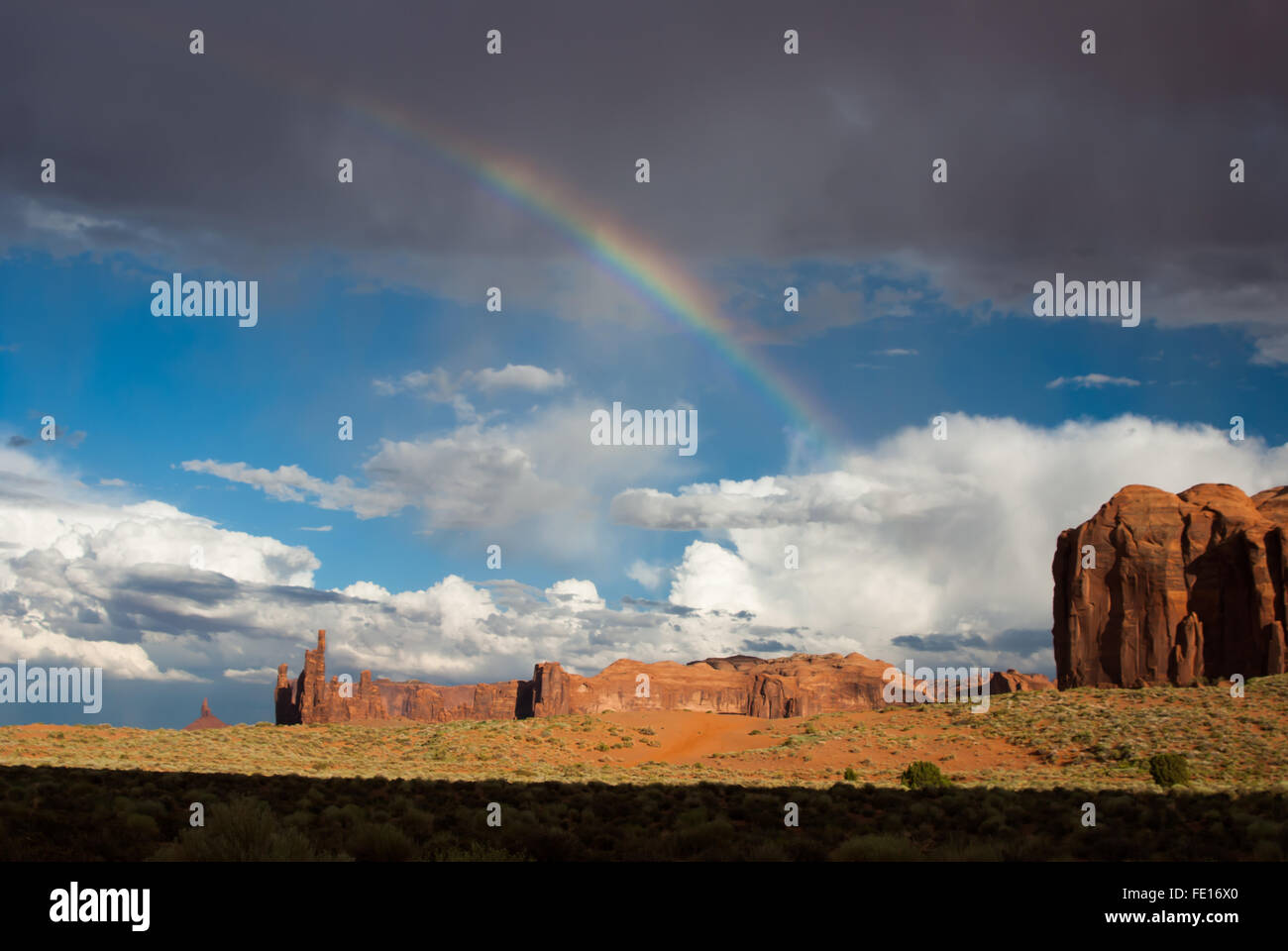 Rainbow appears after storm in Monument Valley desert USA Stock Photo ...