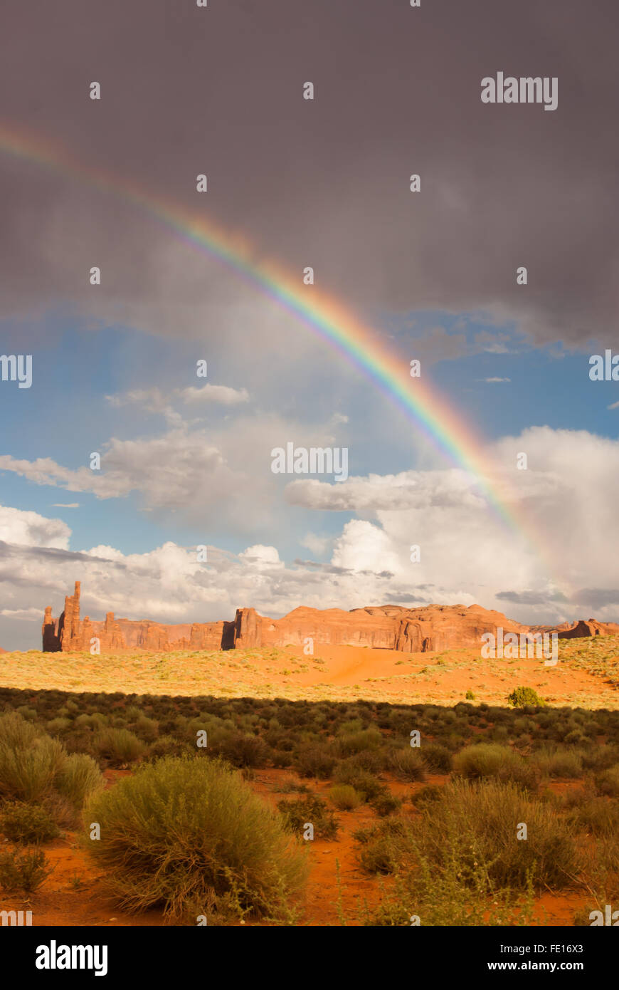 Monument Valley sky lights up with a vibrant rainbow after a storm ...