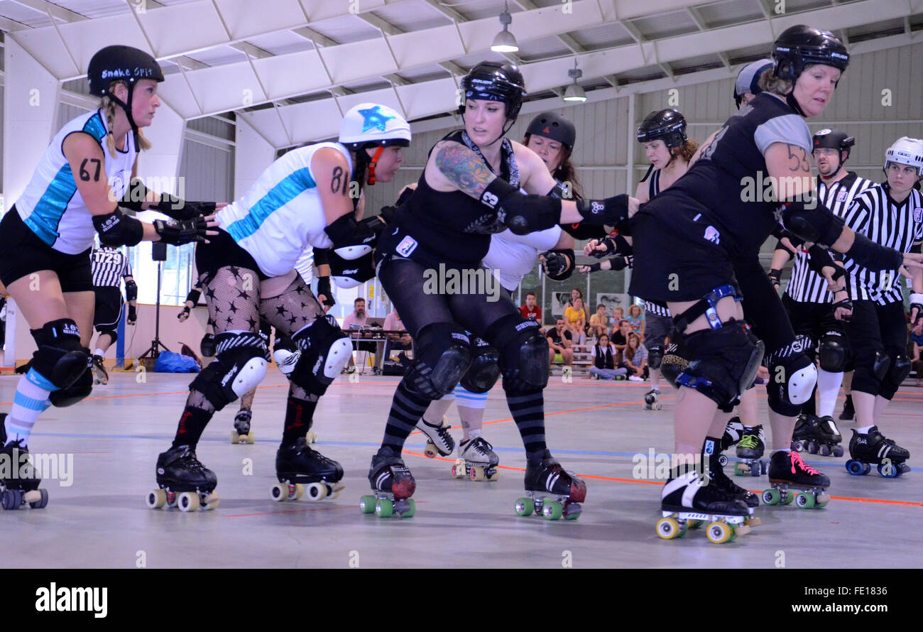 ANN ARBOR, MI - AUGUST 2: Arbor Bruising Co. defense gets ready to block Grand Raggidy G-Rap Attack! jammers at their bout in An Stock Photo