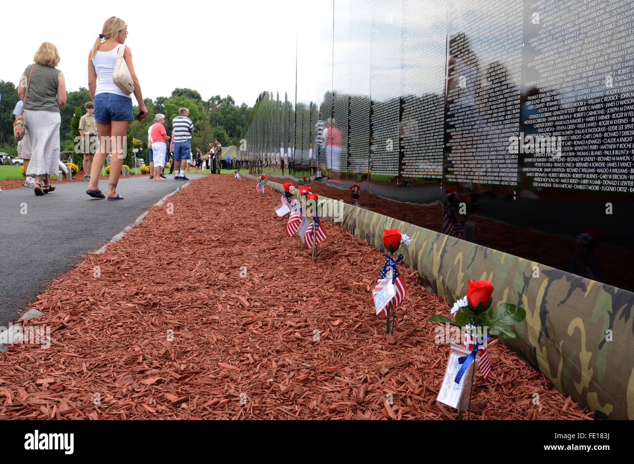 HAMBURG, MI - AUGUST 30: Visitors walk past the traveling Moving Wall ...