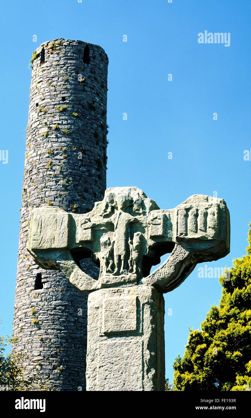 The Unfinished Cross and Round Tower in Celtic Christian churchyard at Kells in County Meath, Ireland Stock Photo