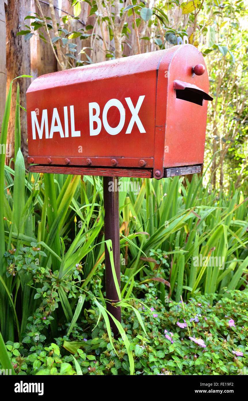 red mail box in the garden Stock Photo Alamy