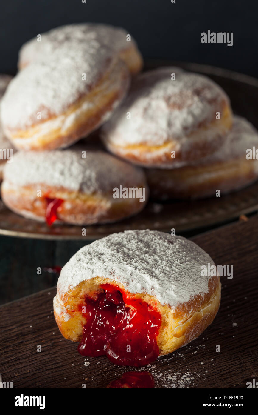Homemade Sugary Paczki Donut with Cherry Filling Stock Photo