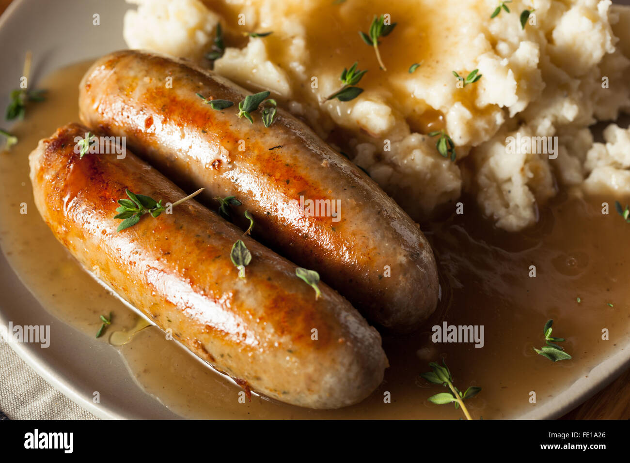 Homemade Bangers and Mash with Herbs and Gravy Stock Photo Alamy