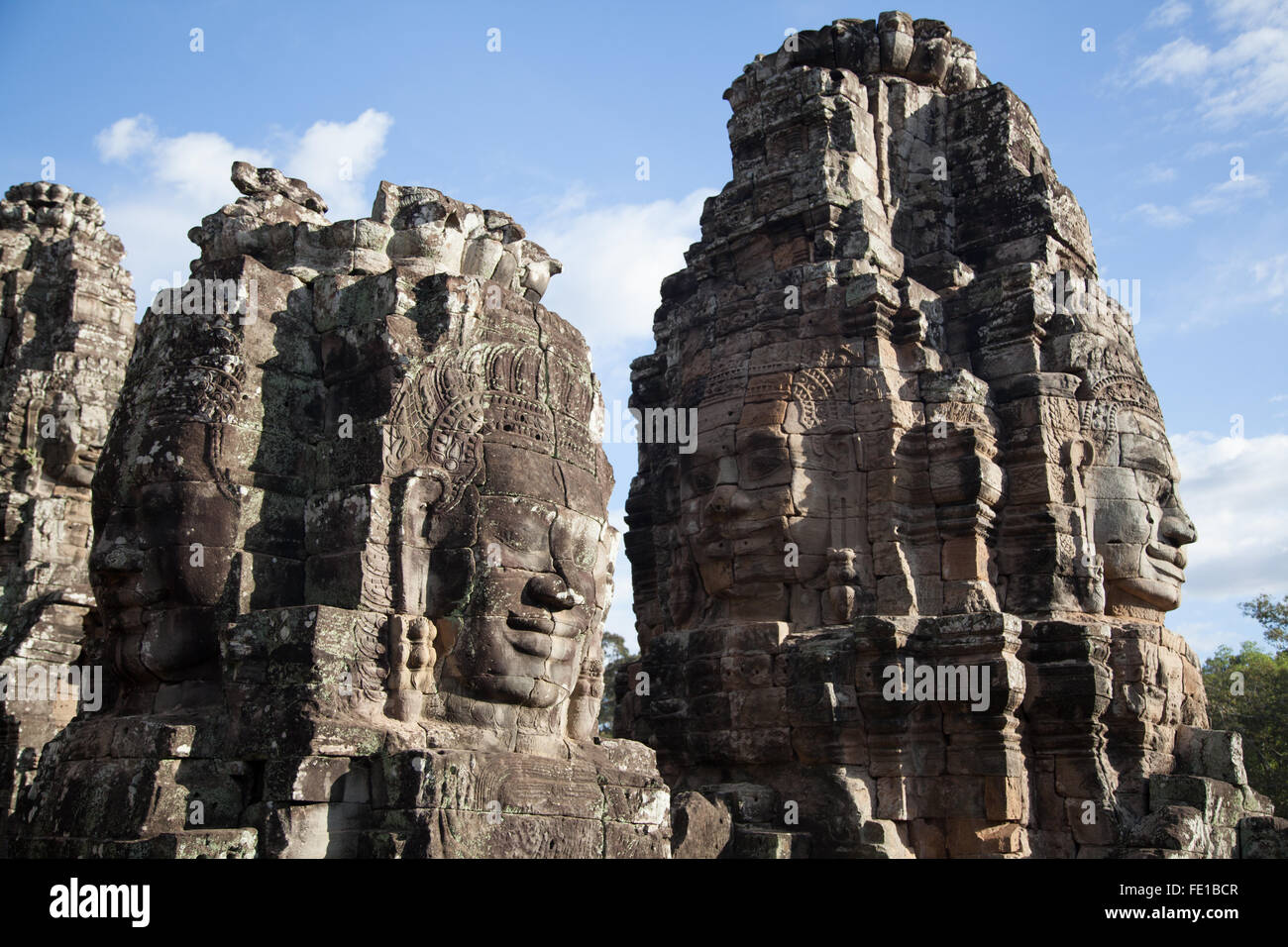 Many statue faces of Bayon, Siem Reap in Cambodia, travel destination Asia Stock Photo