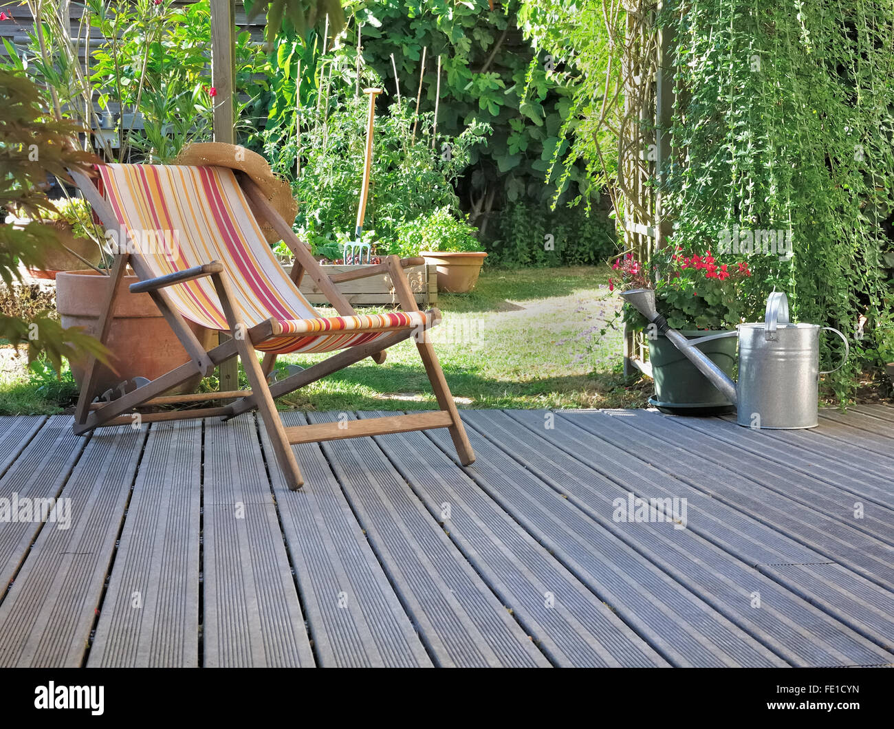 lounge chair on wooden terrace garden Stock Photo