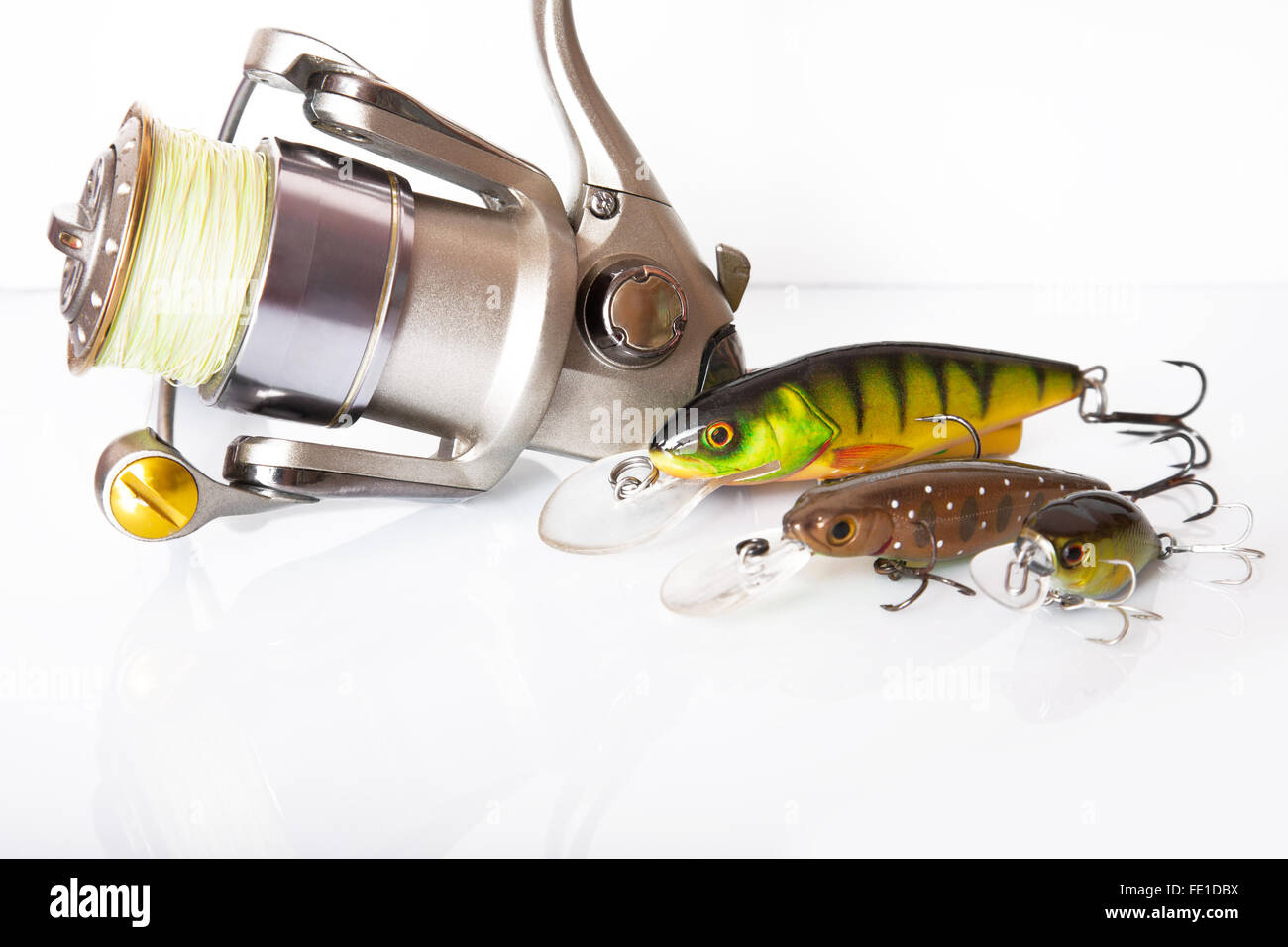 Spinning rod and reel with wobbler lure on white background Stock Photo