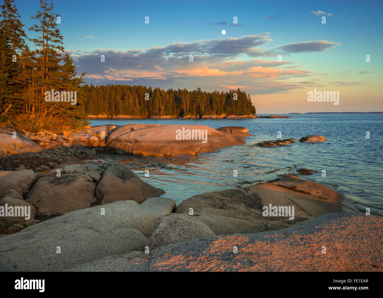 Deer Isle, Maine Evening light and moonrise on the rocky shoreline of Deer Isle Stock Photo Alamy