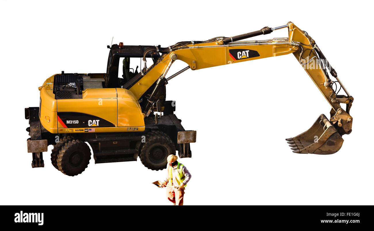 Cut Out Caterpillar M315D Dual Wheel Excavator next to a Construction Worker with a manual shovel on white background Stock Photo