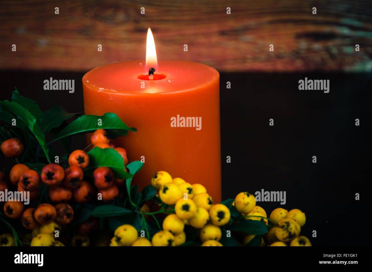 yellow berry and orange candle still life Stock Photo Alamy