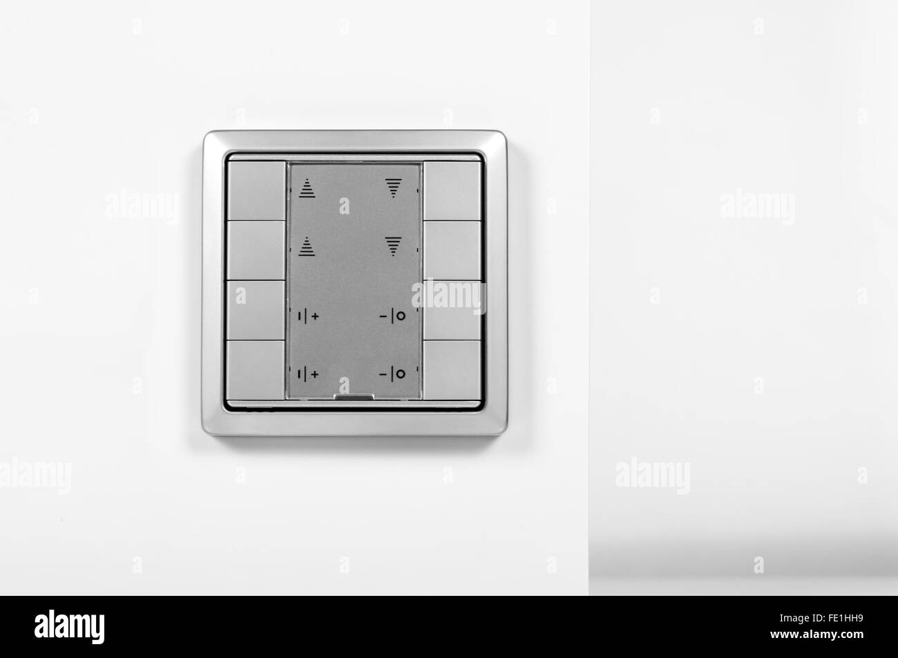 silver modern electronic switch on the wall Stock Photo - Alamy