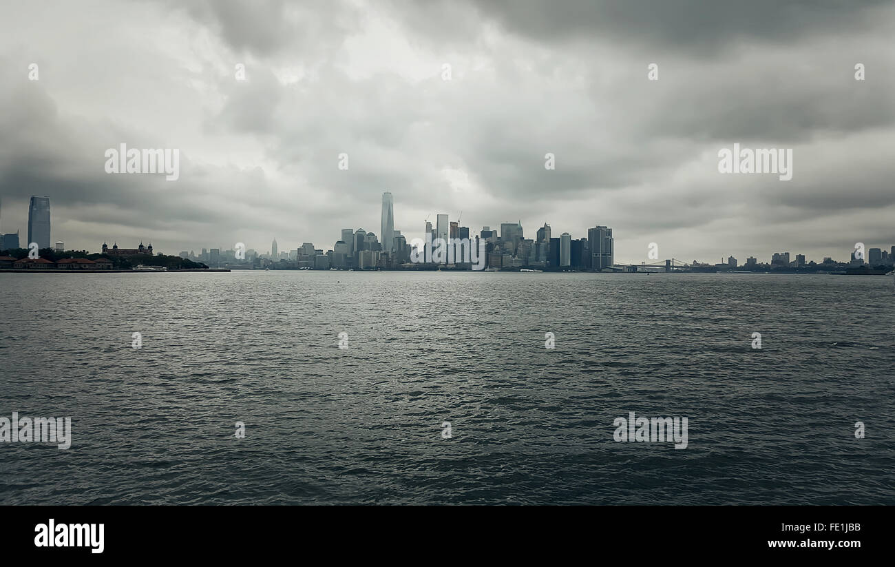 building and skyline of downtown manhattan during a cloudy, rainy day Stock Photo