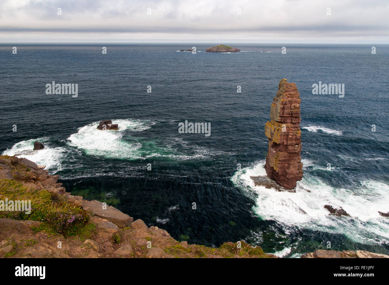 The sea stack Am Buachaille and the island of  Am Balg seen from the cliff top on the headland of Rubh' a Bhuachaille on the Cap Stock Photo
