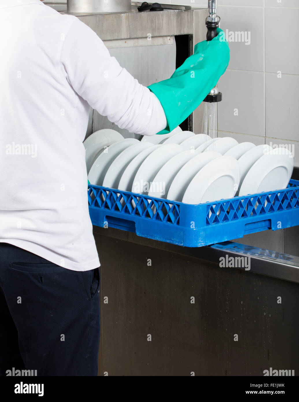 large industrial kitchen dishwasher and sink all stainless steel Stock